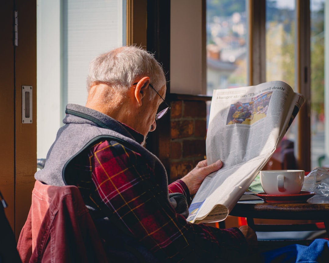 Reading a paper and drinking coffee 